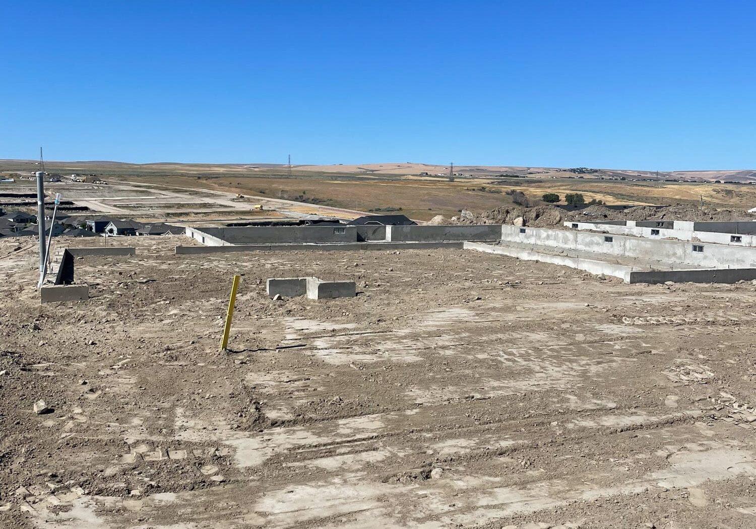 Construction site with clear blue sky background.